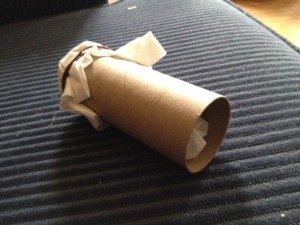 A homemade sploof with a toilet paper roll and dryer sheets.