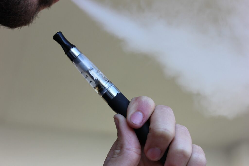 A cannabis user vaporizing the thc infused liquid