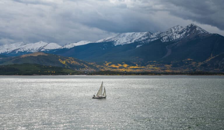 Image of Lake Dillon with a sailboat in autumn
