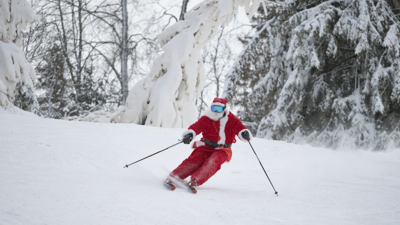 Santa Claus skiing downhill