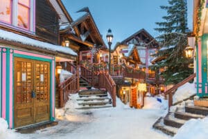 Breckenridge, Colorado, USA downtown streets at night in the winter with holiday lighting.